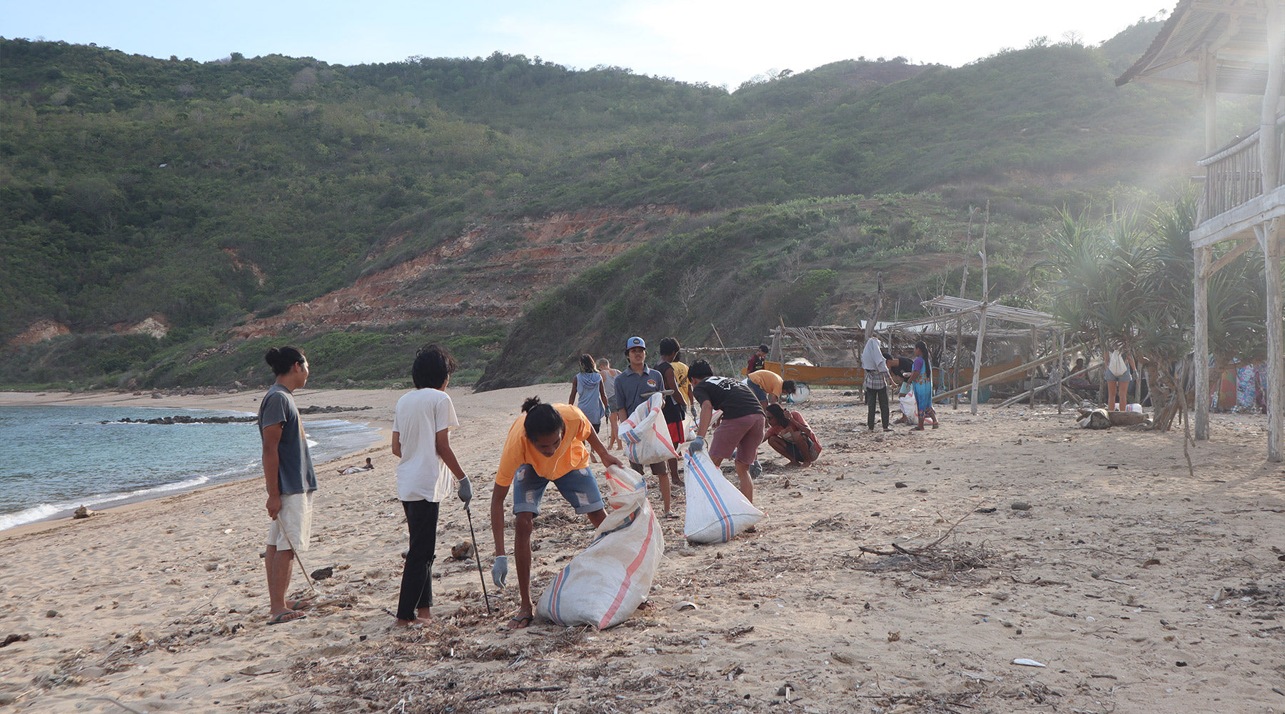 A group of people at a beach clean up in Lombok, organised by Lombok Plastic Free