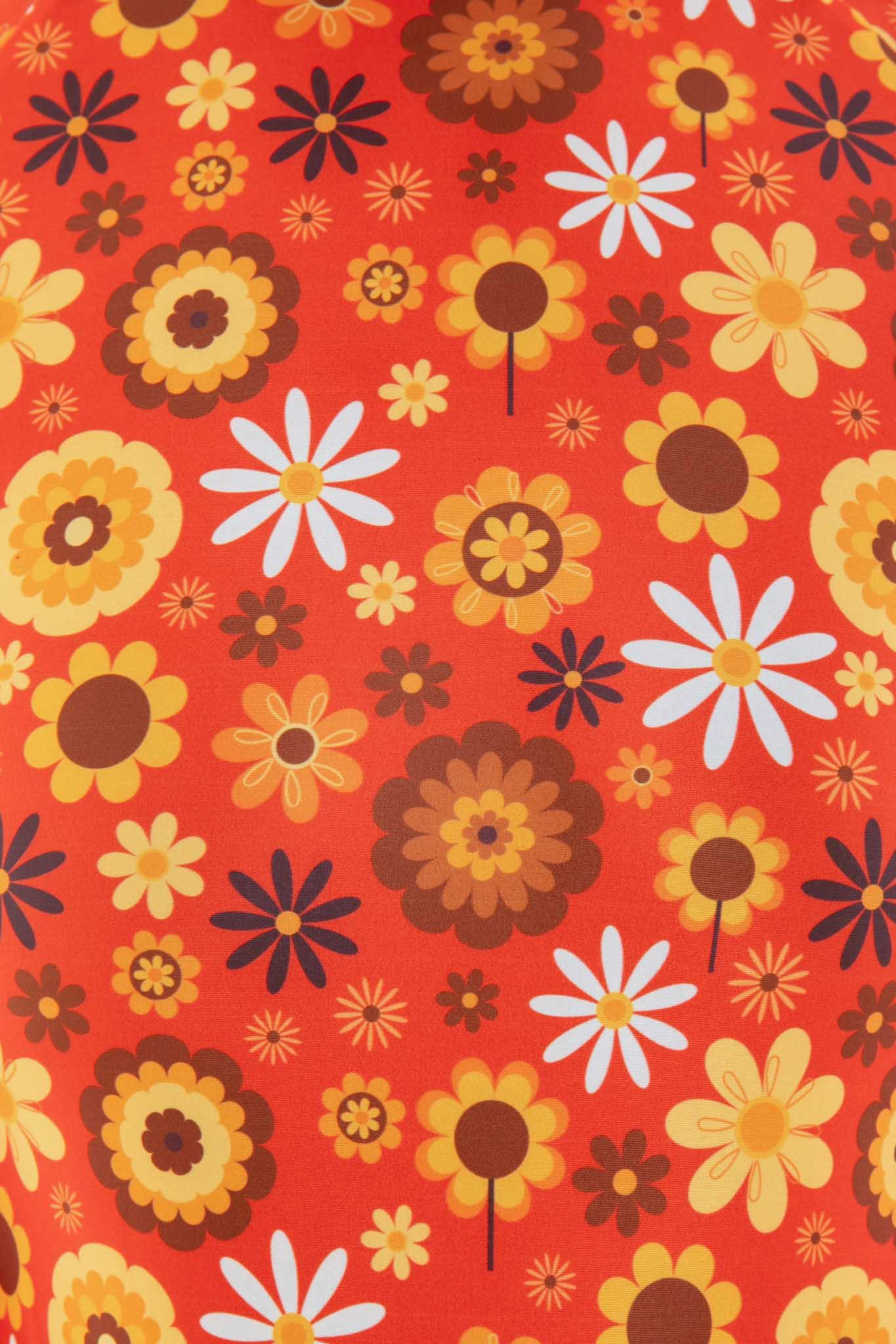 Close-up of the orange retro floral print