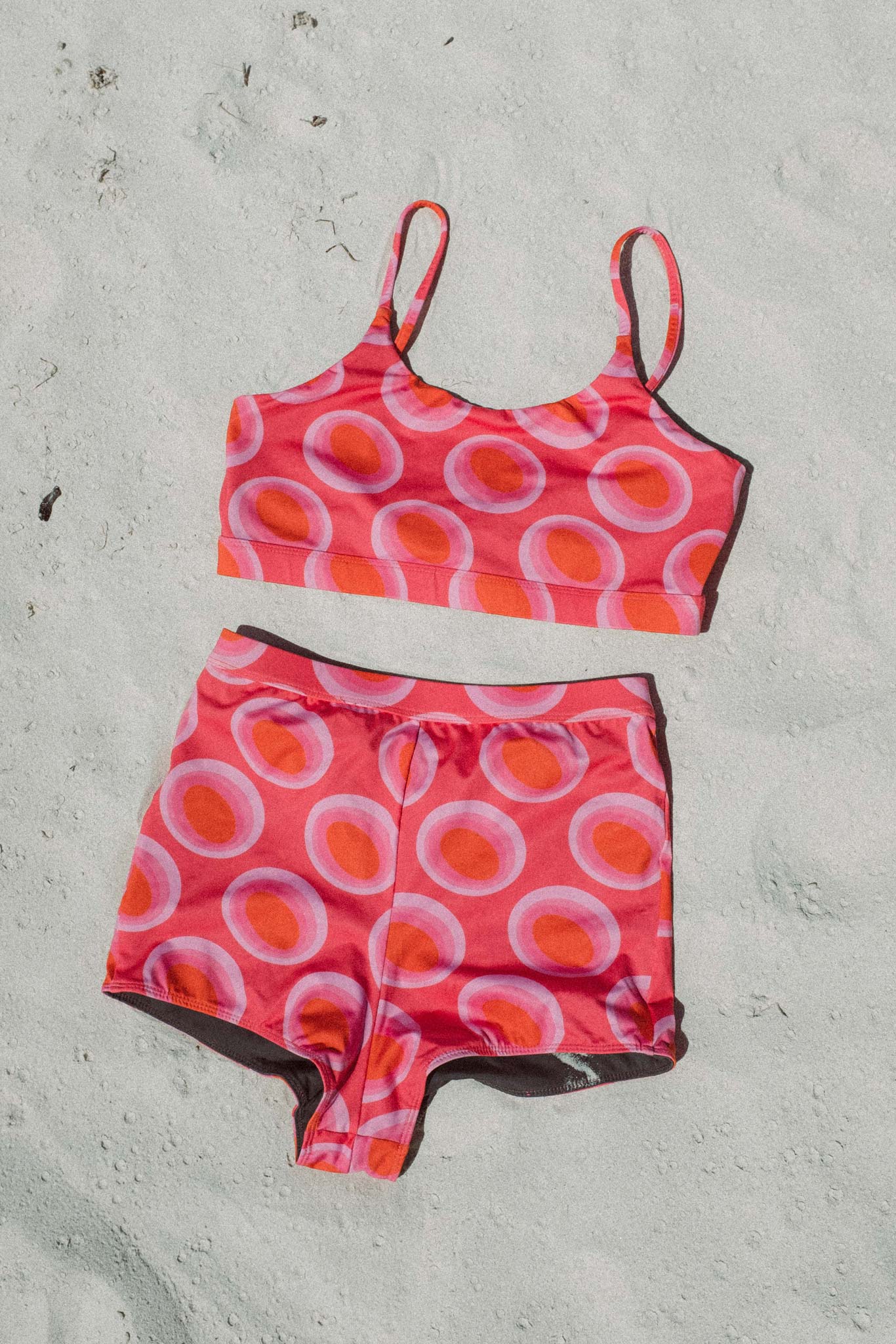 flatlay of the watermelon print surf bikini view from the front on the beach